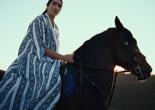 Woman Riding Horse
